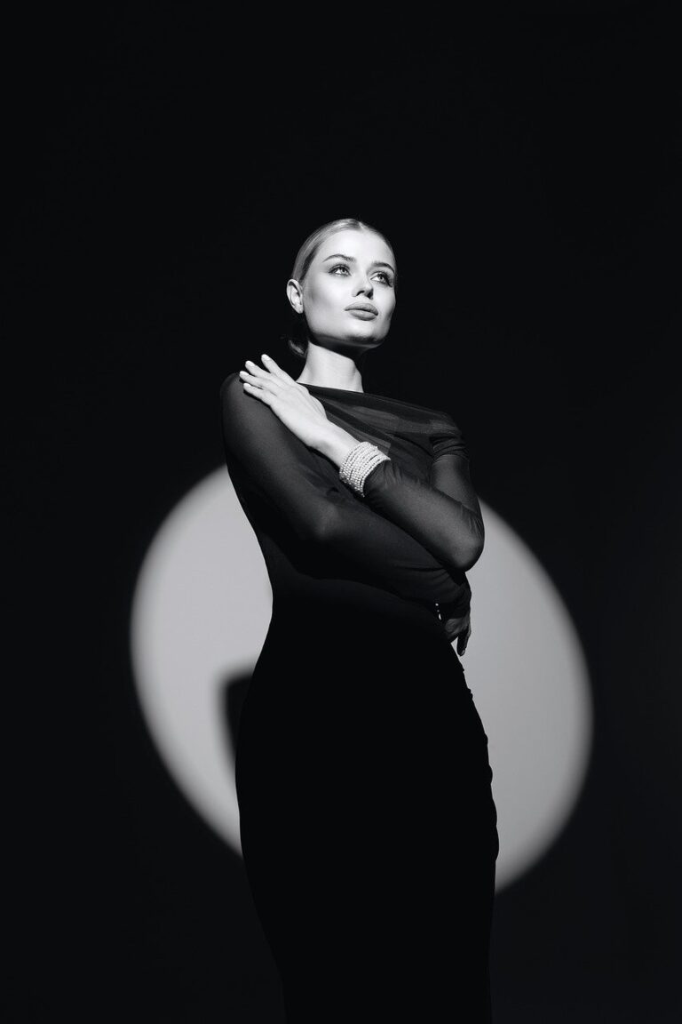 fashion, editorial, model, studio photography, neon lighting, futuristic, high fashion, artistic pose, dramatic lighting, bold colors, avant-garde, elegance, confidence, contemporary, moody atmosphere, creative direction, luxury, portrait, visual storytelling, modern aesthetics