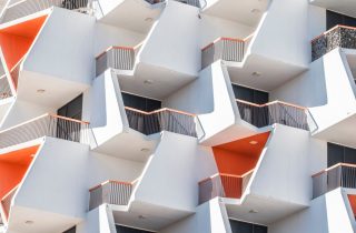 Discover the unique geometric facade of a modern Dubai apartment building, capturing repetition and design innovation.