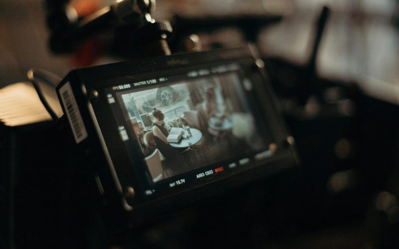 A detailed look at the behind-the-scenes setup of a film shoot with focus on the video monitor.
